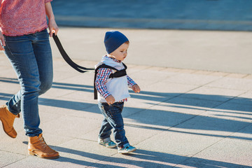  Mom insures her child during a walk