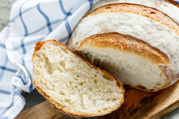Sliced crusty homemade organic french bread.