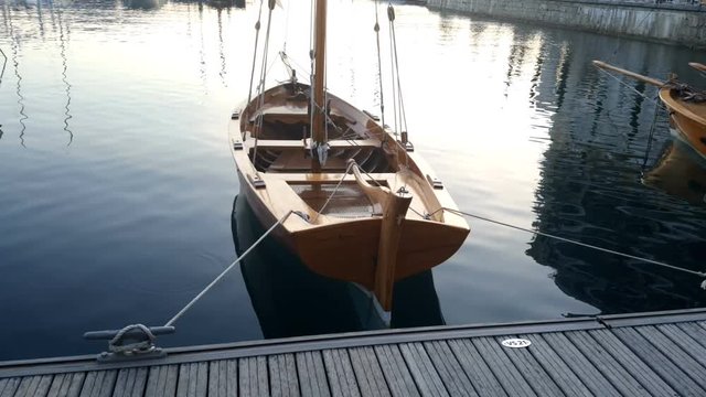 Wooden boat at the pier in the evening.