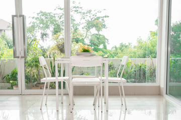 White table and chair for sit read book in the sunny day,relax,bright sunlight