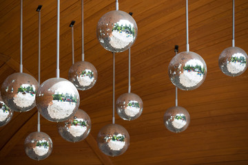 Mirror disco balls hanging. Reflections, dance and celebration.
