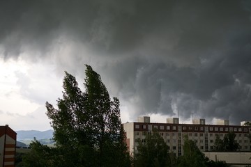 Fototapeta na wymiar Heavy storm clouds and strong wind over the town. Slovakia
