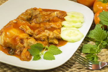 Tomato soup with meat, melissa leaves and cucumber slices