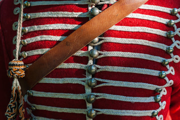 Details of a dolman hussar jacket