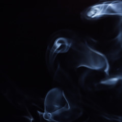 Abstract figure of bluish smoke on a dark background. A collection of square backgrounds and textures.