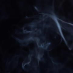 Abstract figure of bluish smoke on a dark background. A collection of square backgrounds and textures.