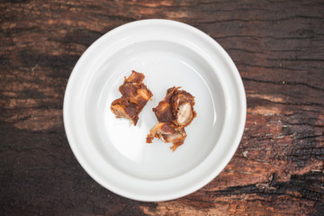 Ground rice in white bowl on wood table,prepare cooking