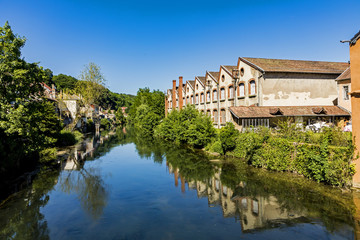 Fototapeta na wymiar typical small village L-Isle-sur-le-Doubs in France with river Doubs