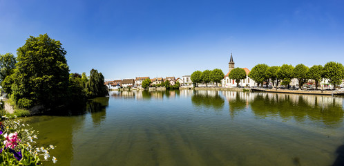 Fototapeta na wymiar skyline of Audincourt at the river Doubs in France