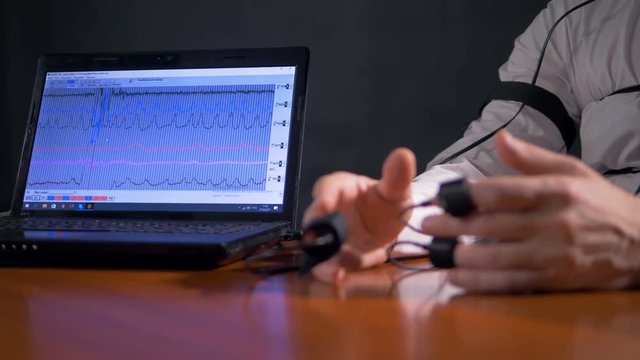 Focused sequence of polygraph data on screen. 4K 60 fps.