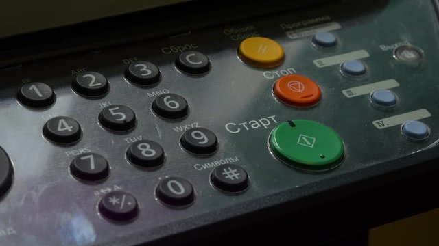 Man Finger Dials The Numbers On MFP