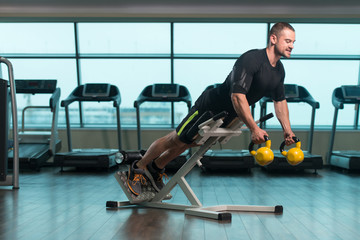 Fitness Man Doing Exercise With Kettle Bell