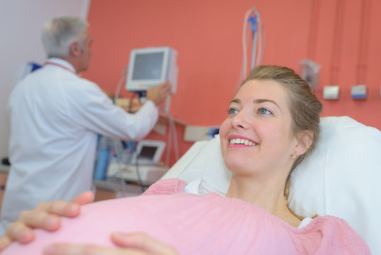 happy pregnant woman at hospital