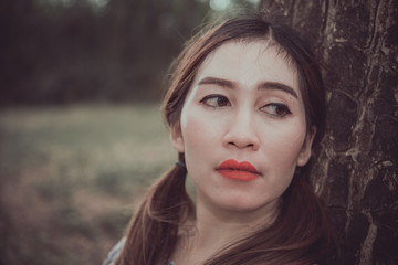 Naklejka premium Beautiful thai woman very sad from unrequited love,rethink,think over,vintage style,dark tone,broken heart,asian girl