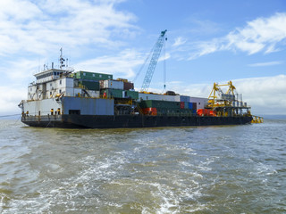 Naklejka premium The cargo ship with the crane, the top view. Pipelaying barge.