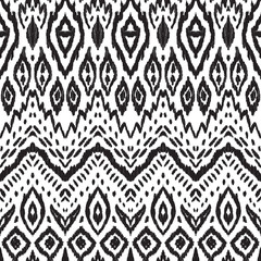 Abstract background. Black and white Ikat seamless pattern for textile, wallpaper, card or wrapping paper.