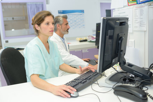 nurse and doctor sitting in office