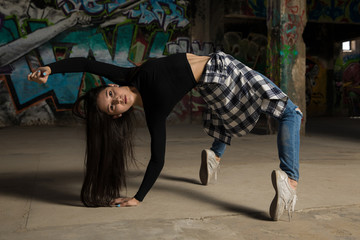 Female dancer tiptoeing and bending