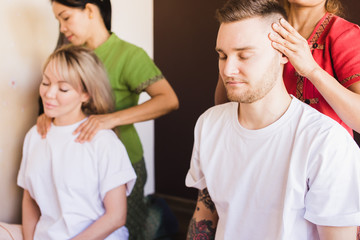 Masseur doing head massage on man in the spa salon © alfa27