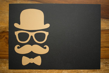 Father's Day card on desk - Man face cut out, gold and black