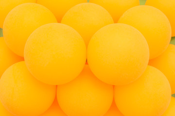 Yellow tennis balls sequentially arranged, abstract background