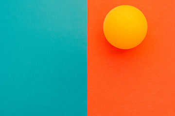 yellow tennis ball on a red blue background