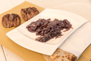 Piadina Romagnola with sausage and onion