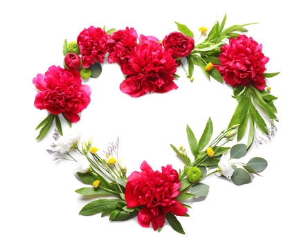 Heart shape frame made with beautiful flowers on white background. Creativity concept