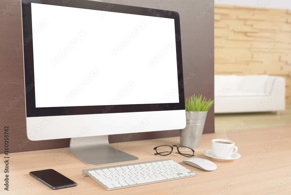 Aufkleber desktop computer on work table showing white screen perspective angle view