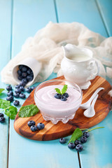 Yogurt with bilberry. Selective focus.