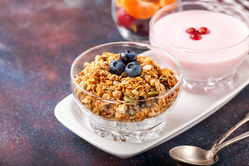 Healthy breakfast - muesli, yogurt and fruits. Selective focus. Copy space. Top view