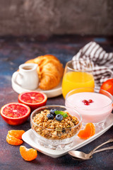 Healthy breakfast - muesli, yogurt and fruits. Selective focus. Copy space. Top view