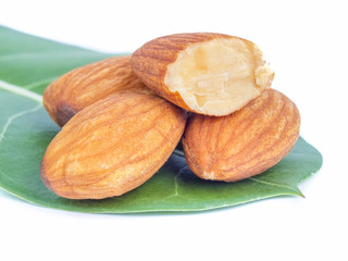 created shot of almonds on white background