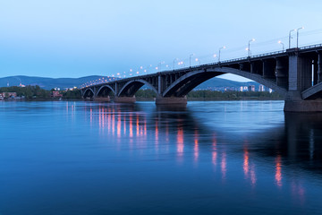 Fototapeta na wymiar View of the Communal bridge across the Yenisei River in Krasnoyarsk