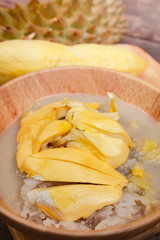 Sticky rice with durian and coconut milk sauce.