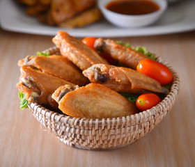 fried chicken wing on basket