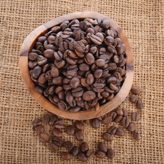 Close up of coffee bean in wooden bolw