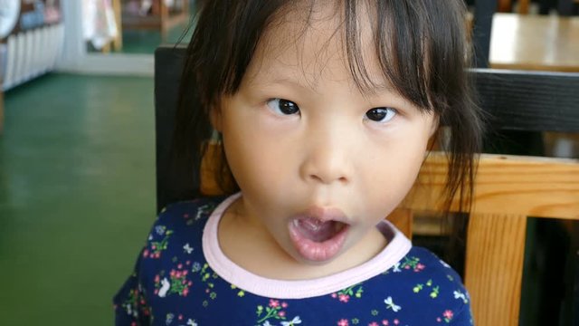 Funny asian girl make strabismus 
