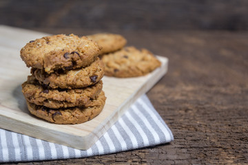 oat and Chocolate chip cookies on rustic wooden table background