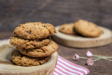 oat and Chocolate chip cookies on rustic wooden table background