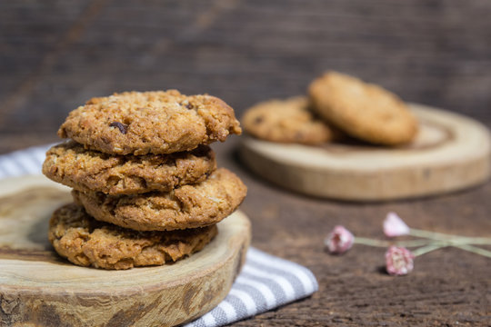 Oat And Chocolate Chip Cookies On Rustic Wooden Table Background