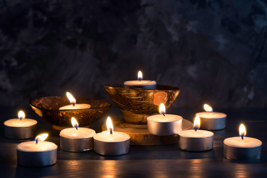 Many burning candles in dark background   in concept spa relaxing , holiday ,merry christmas, REST IN PEACE