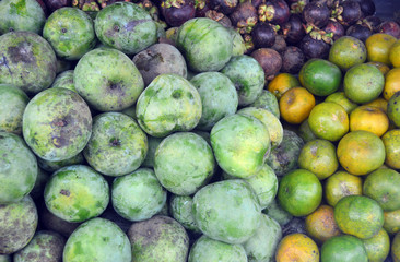 Fruit of mango, citrus fruit, and mangosteen fruit in one frame