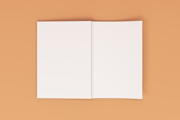 Mockup of blank white open brochure lying with cover upside on orange background