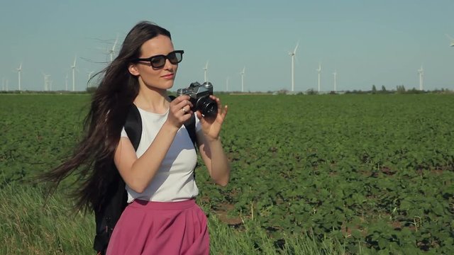 Girl taking pictures with vintage camera