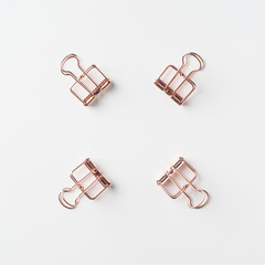 Top view of empty copper clip on white background desk for mockup, collection of diverse angle..