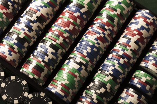 Casino concept. Stacks of poker chips. Colorful bokeh.