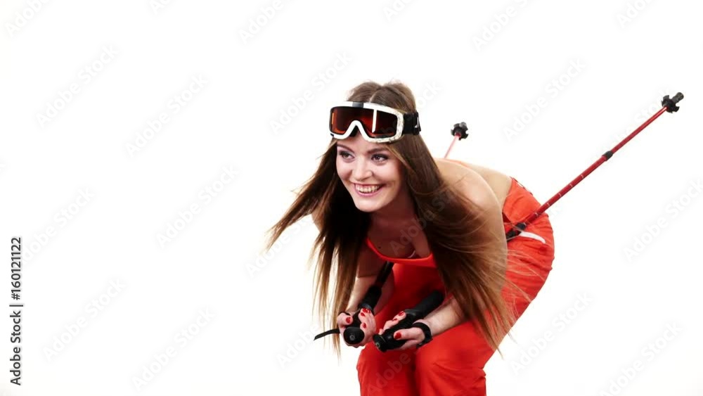 Poster Woman skier preparing for season. Young girl with skiing gear bending squat down. Winter sport activity, healthy leisure relax concept. Joyful sportswoman isolated on white, studio shot, full HD.