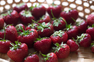 Fresh juicy strawberries on a wooden board.