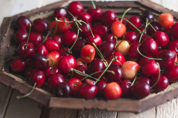 Cherry berries are fresh on a wooden background. Concept of health.